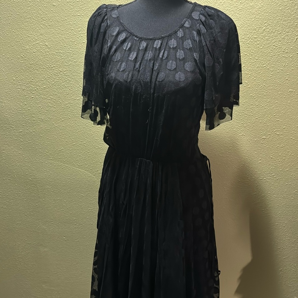 Black see-through-with cut out back .